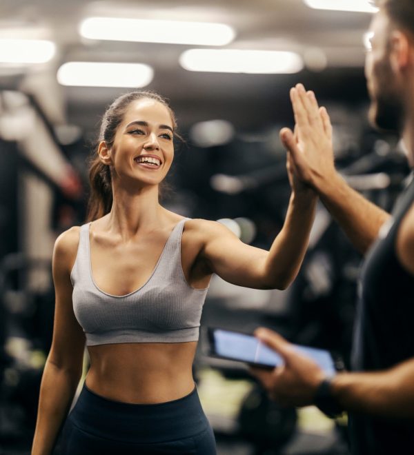 Portrait,Of,A,Fit,Happy,Sportswoman,Giving,High,Five,To