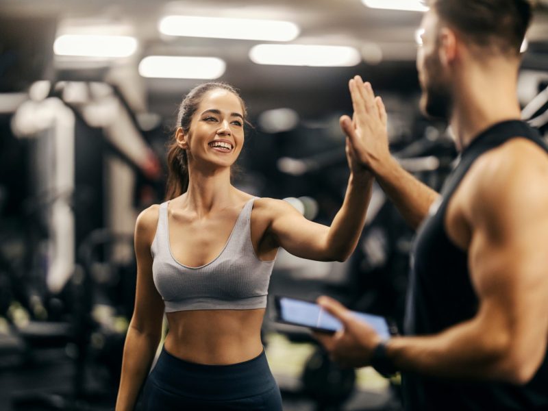 Portrait,Of,A,Fit,Happy,Sportswoman,Giving,High,Five,To
